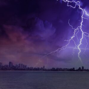 Dramatic lightning strike illuminating a dark