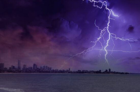 Dramatic lightning strike illuminating a dark