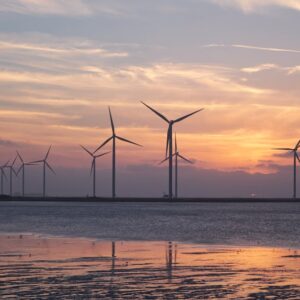 Sleek modern solar panels under a vibrant blue sky with clouds