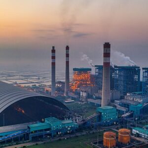 Urban gas station illuminated with vibrant neon lights at night. Modern transportation hub.